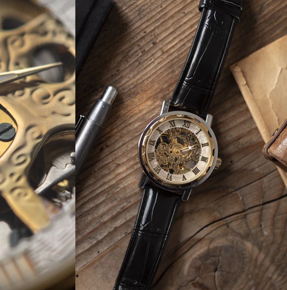 Watch on wooden table with tools